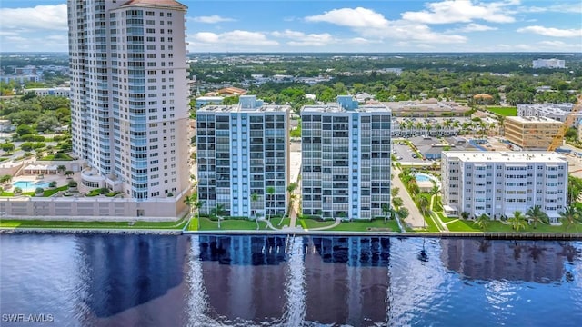 bird's eye view featuring a water view and a city view