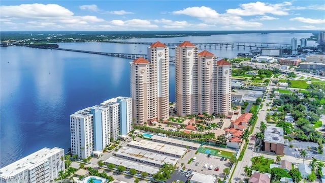 drone / aerial view featuring a water view and a city view