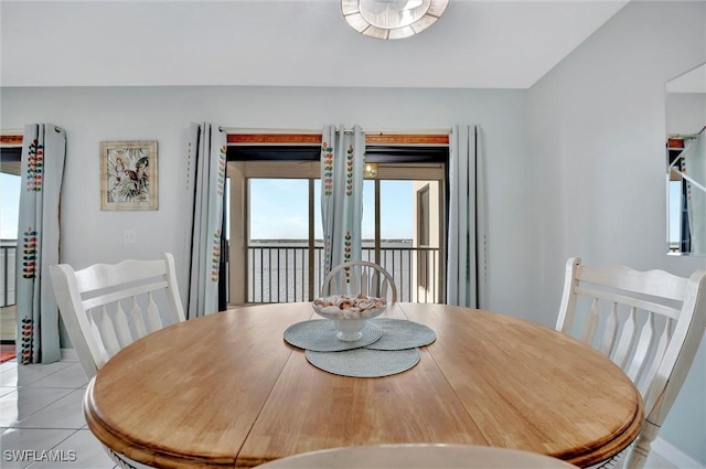 dining area featuring light tile patterned floors