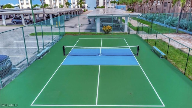 view of sport court with fence