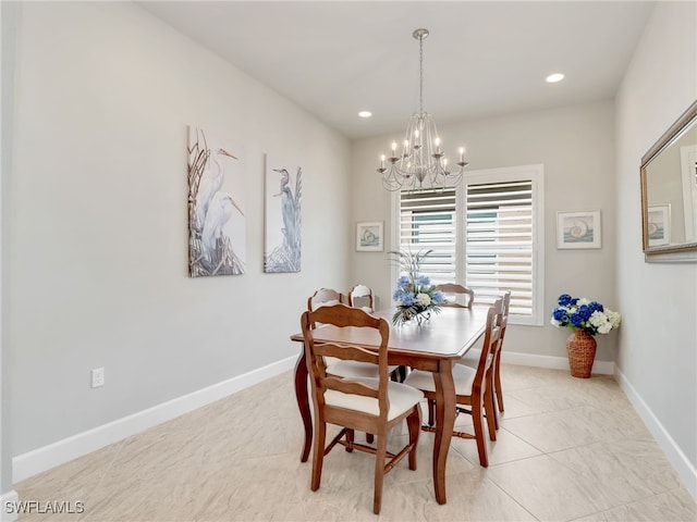 dining area with light tile patterned floors and a notable chandelier