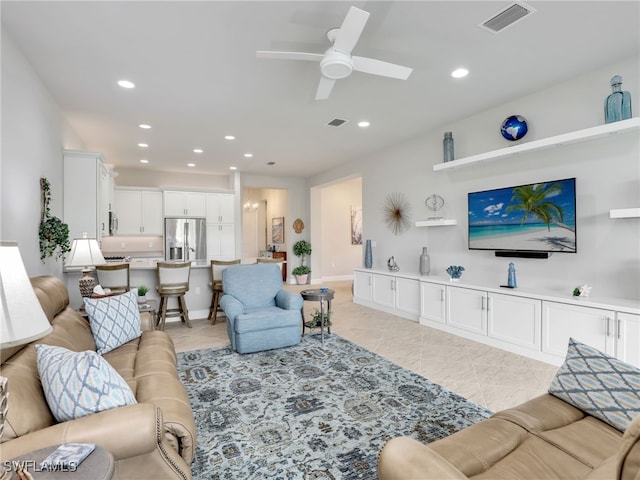 living room with light tile patterned flooring and ceiling fan