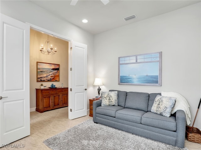 living room featuring light tile patterned floors and a notable chandelier