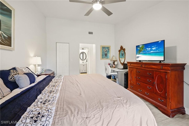 bedroom featuring ceiling fan, connected bathroom, and a closet