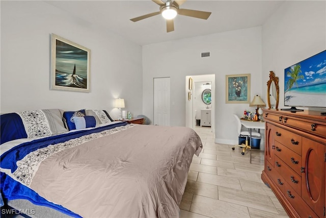 bedroom with ceiling fan and ensuite bathroom