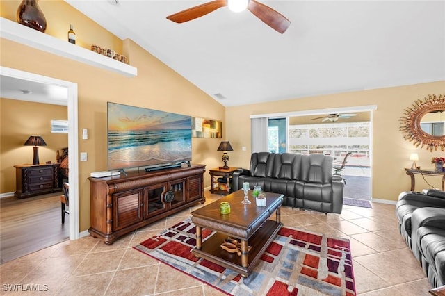 tiled living room featuring lofted ceiling and ceiling fan