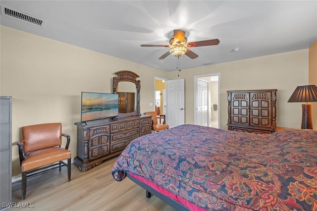 bedroom with ceiling fan and light hardwood / wood-style flooring