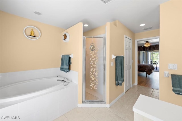 bathroom featuring plus walk in shower and tile patterned flooring