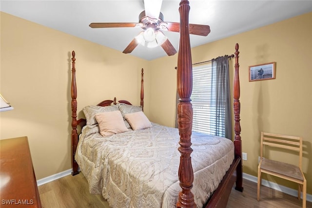 bedroom with ceiling fan and light wood-type flooring