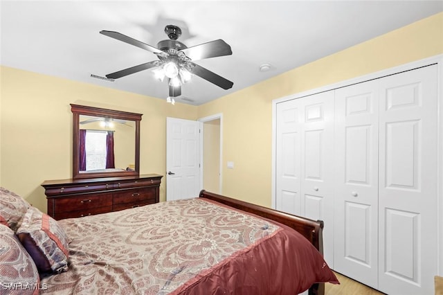 bedroom featuring ceiling fan and a closet