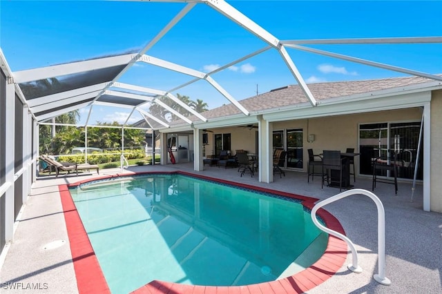 view of pool featuring a lanai and a patio area