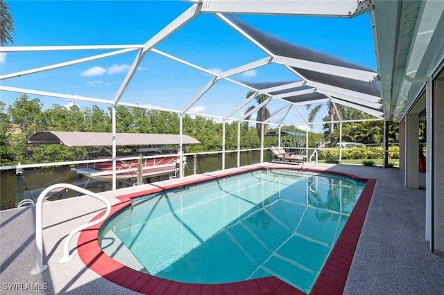 view of swimming pool with a water view, a lanai, and a dock