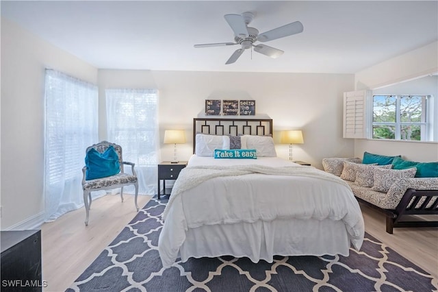 bedroom with light wood finished floors and ceiling fan