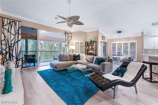 living area with light wood-style floors, visible vents, crown molding, and a ceiling fan