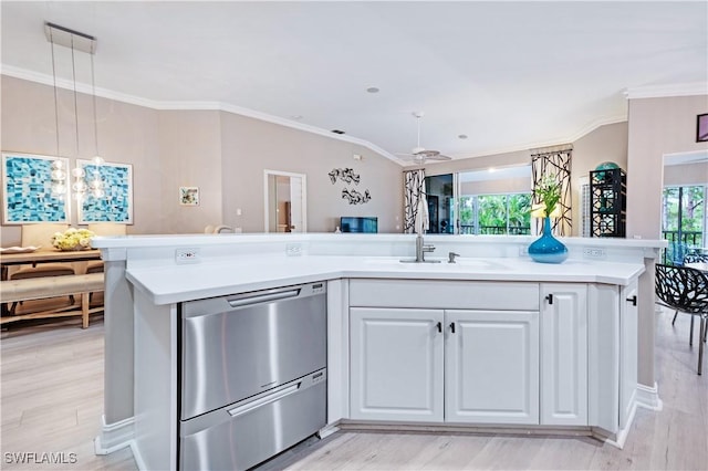 kitchen featuring decorative light fixtures, light countertops, stainless steel dishwasher, a kitchen island with sink, and white cabinetry