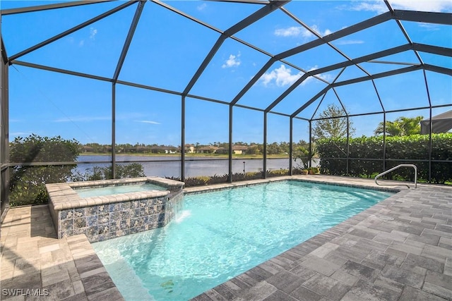 pool with a patio, a water view, a lanai, and an in ground hot tub