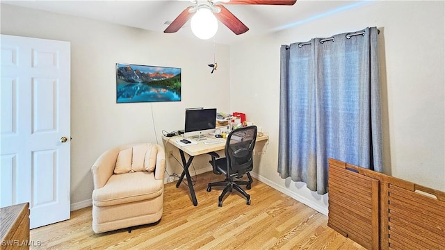 home office featuring ceiling fan and light hardwood / wood-style flooring