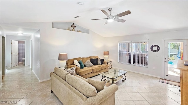 living room with lofted ceiling, light tile patterned floors, and ceiling fan