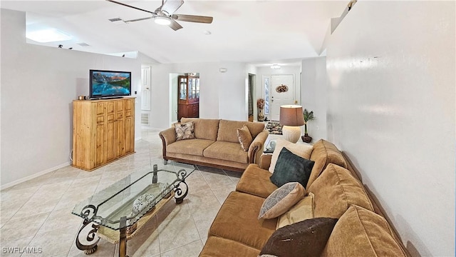 tiled living room with lofted ceiling and ceiling fan