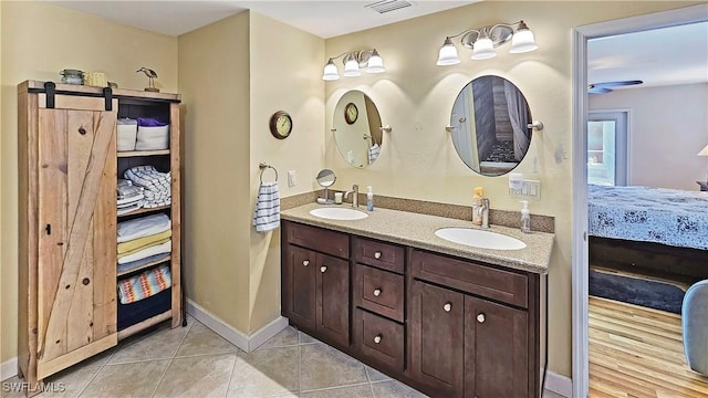 bathroom with tile patterned flooring and vanity