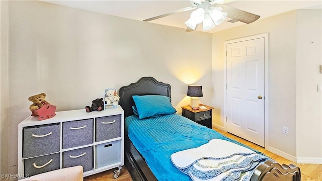 bedroom featuring hardwood / wood-style floors and ceiling fan