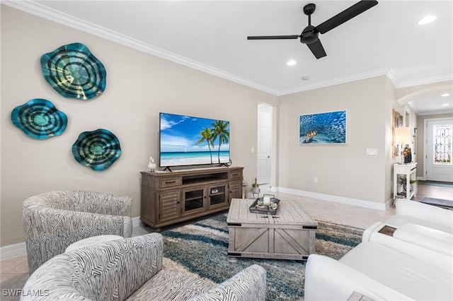 living room with arched walkways, crown molding, recessed lighting, ceiling fan, and baseboards