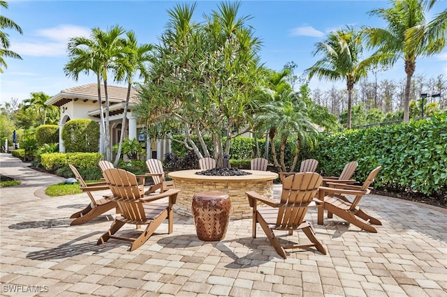 view of patio / terrace with an outdoor fire pit