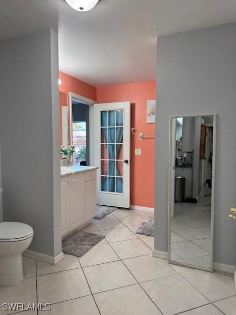 bathroom with tile patterned floors, toilet, and vanity