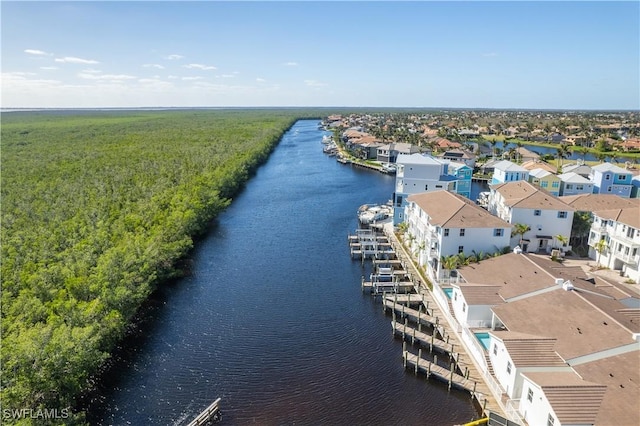 birds eye view of property with a water view and a residential view