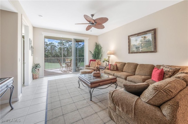 living area with a ceiling fan and light tile patterned flooring