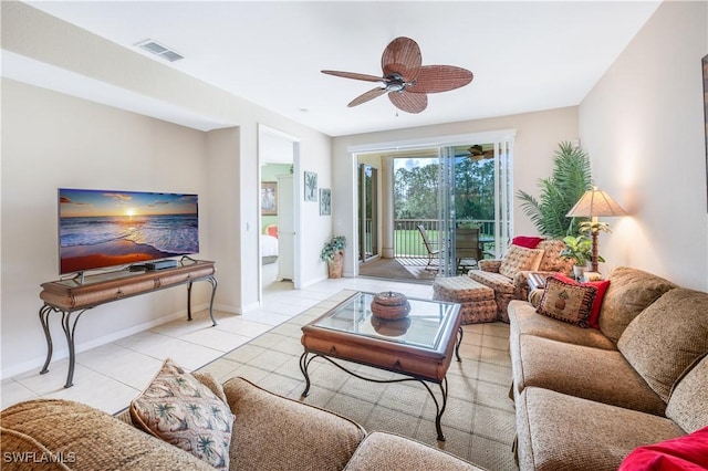 living area with a ceiling fan, visible vents, baseboards, and light tile patterned flooring