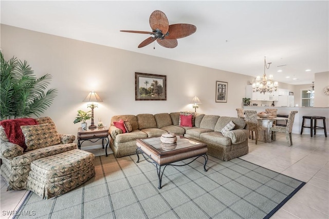 living area featuring ceiling fan with notable chandelier and light tile patterned flooring