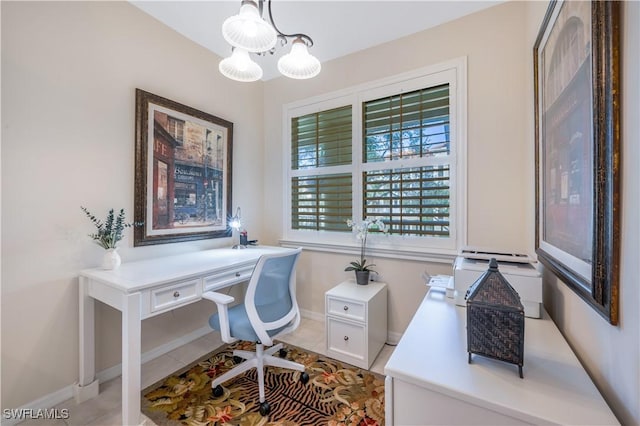 office space featuring a notable chandelier, baseboards, and light tile patterned floors