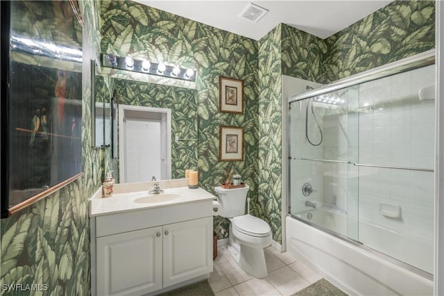 bathroom featuring vanity, visible vents, and wallpapered walls