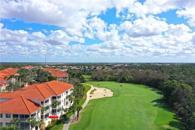 birds eye view of property with view of golf course