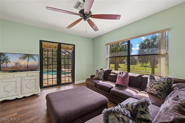 living room featuring ceiling fan, french doors, and hardwood / wood-style floors