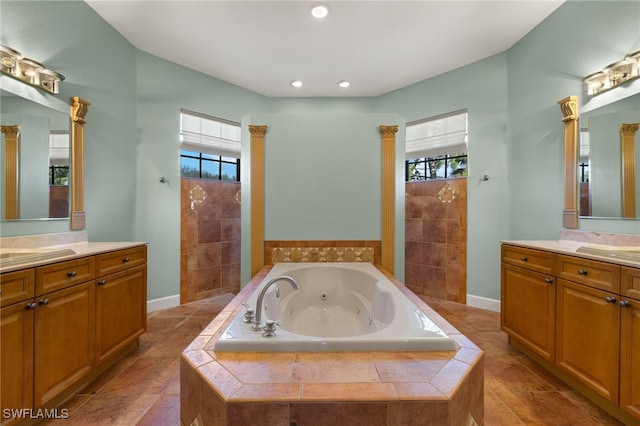 bathroom with a wealth of natural light, plus walk in shower, and vanity