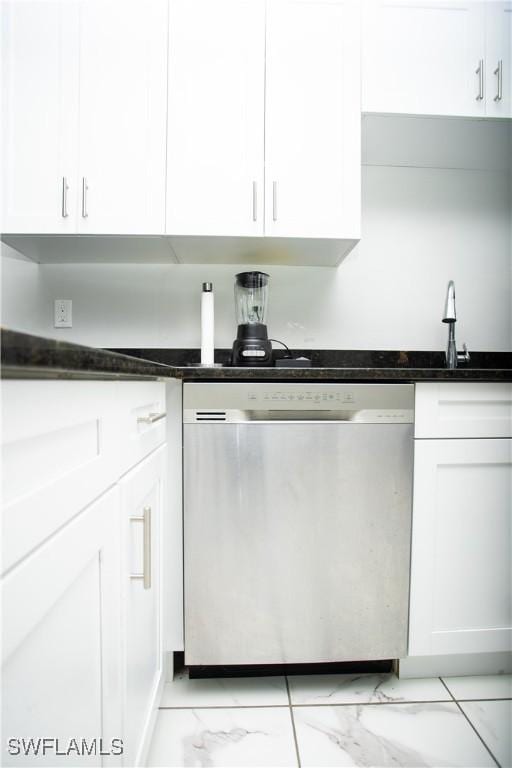kitchen with stainless steel dishwasher and white cabinets
