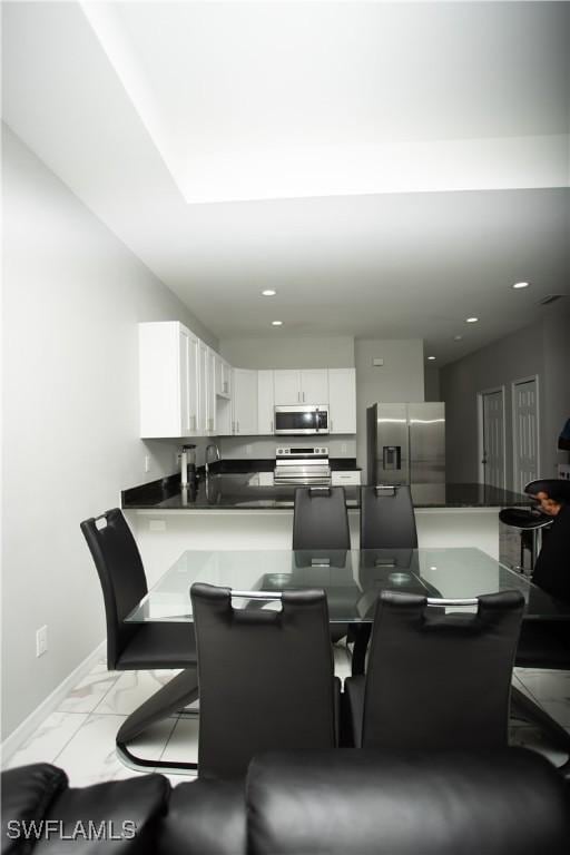 dining space with sink