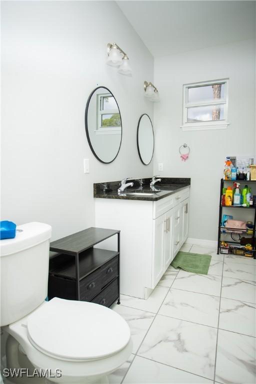 bathroom with vanity and toilet
