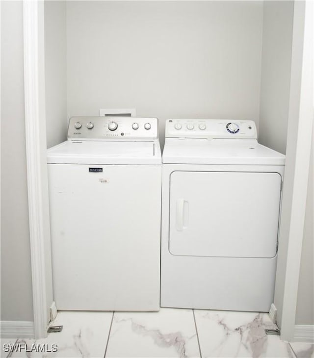 laundry room featuring separate washer and dryer