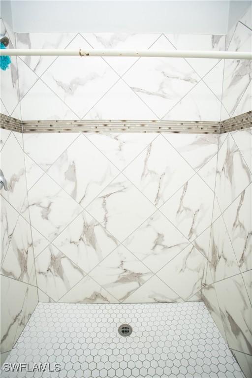 interior space with tiled shower