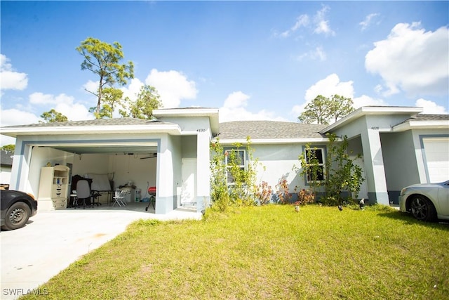 view of front of home featuring a garage and a front lawn