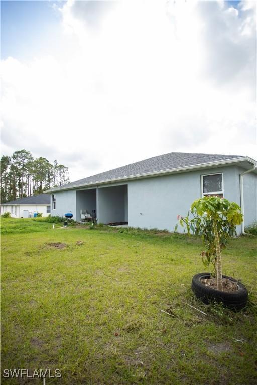 view of property exterior featuring a lawn
