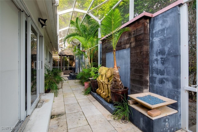 view of patio / terrace with glass enclosure