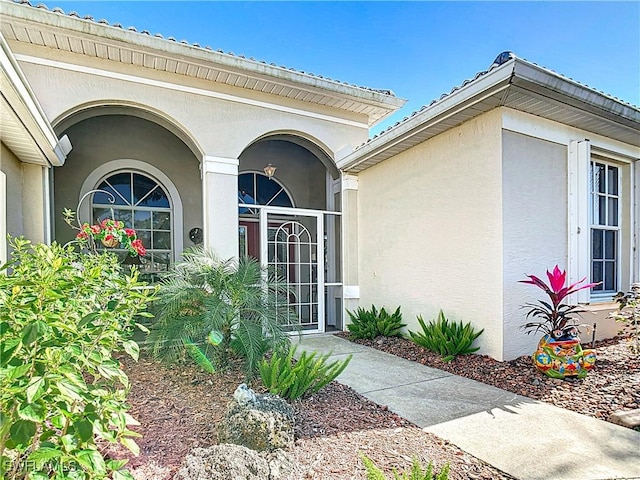 20790 Athenian Ln, North Fort Myers, FL 33917 - doorway to property with stucco siding