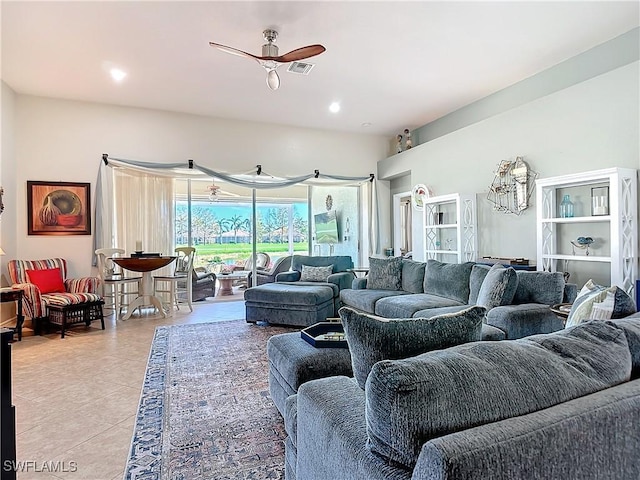 living room featuring ceiling fan and light tile patterned floors