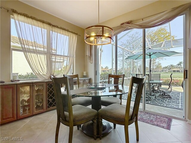 20790 Athenian Ln, North Fort Myers, FL 33917 - dining room with an inviting chandelier and light tile patterned flooring