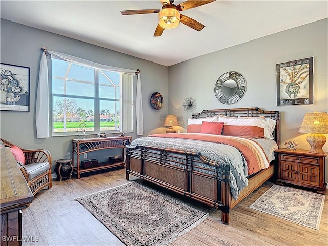 bedroom featuring ceiling fan and hardwood / wood-style floors