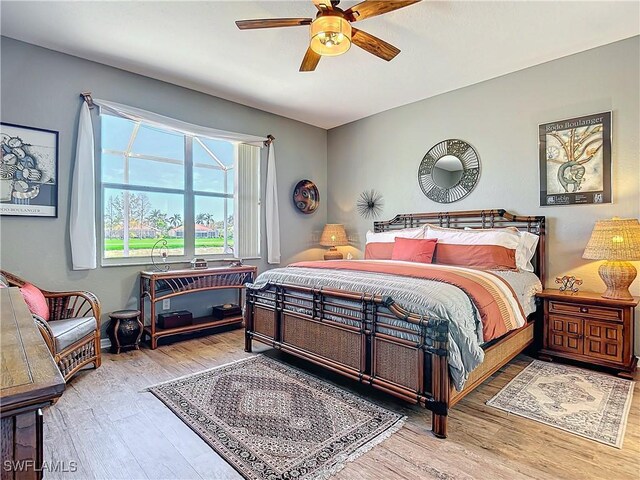 20790 Athenian Ln, North Fort Myers, FL 33917 - bedroom featuring wood finished floors and ceiling fan